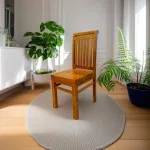Wooden dining chair crafted from authentic Nilambur teak wood