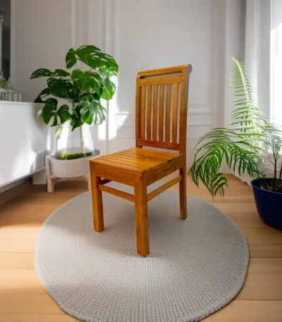 Wooden dining chair crafted from authentic Nilambur teak wood